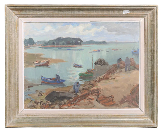 Framed painting of a coastal scene with boats and people on a beach.
