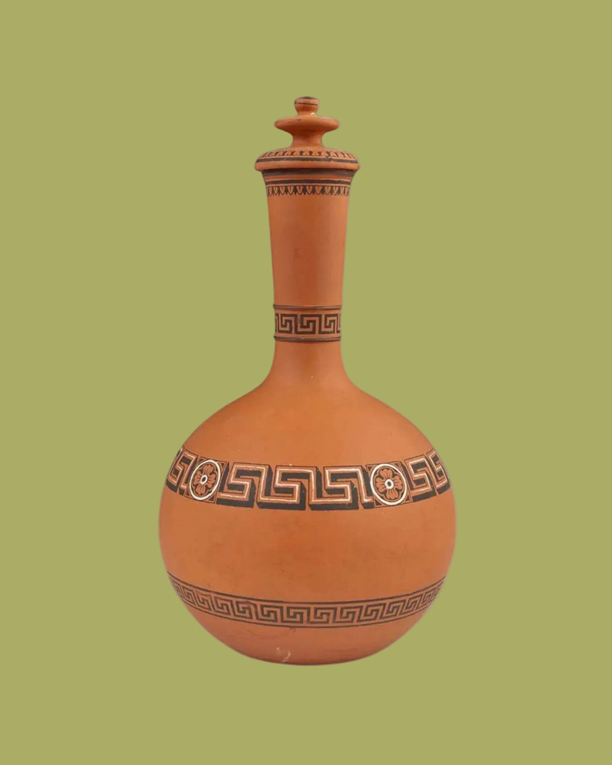 Terracotta vase with decorative patterns on a white background