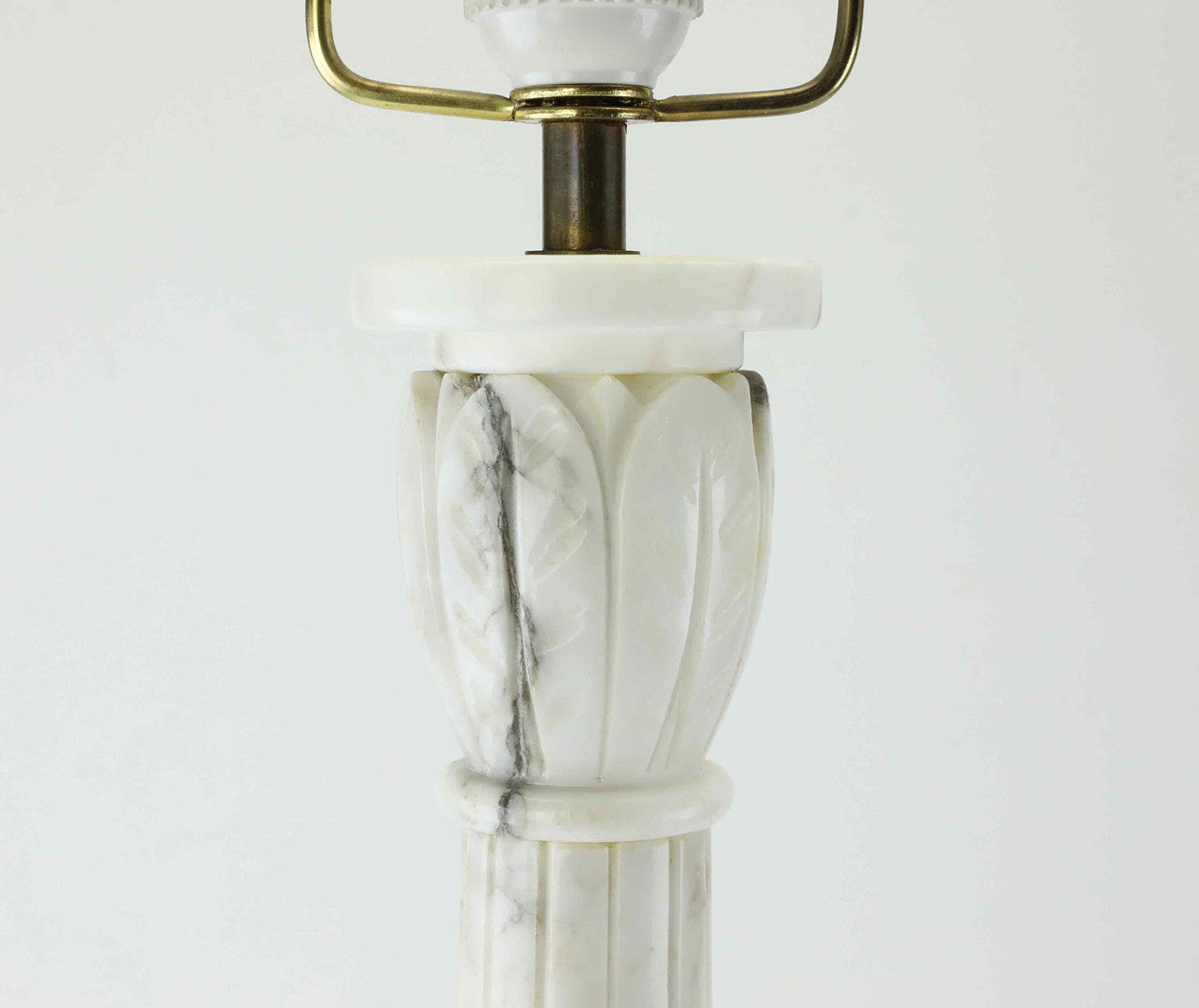 Carved marble capital detail on vintage column table lamp