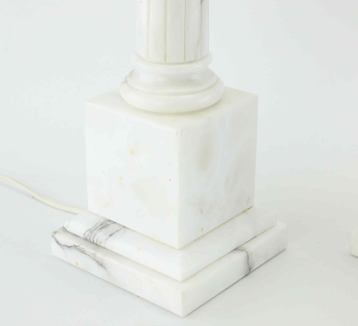 Close-up of marble base and veining on vintage column lamp