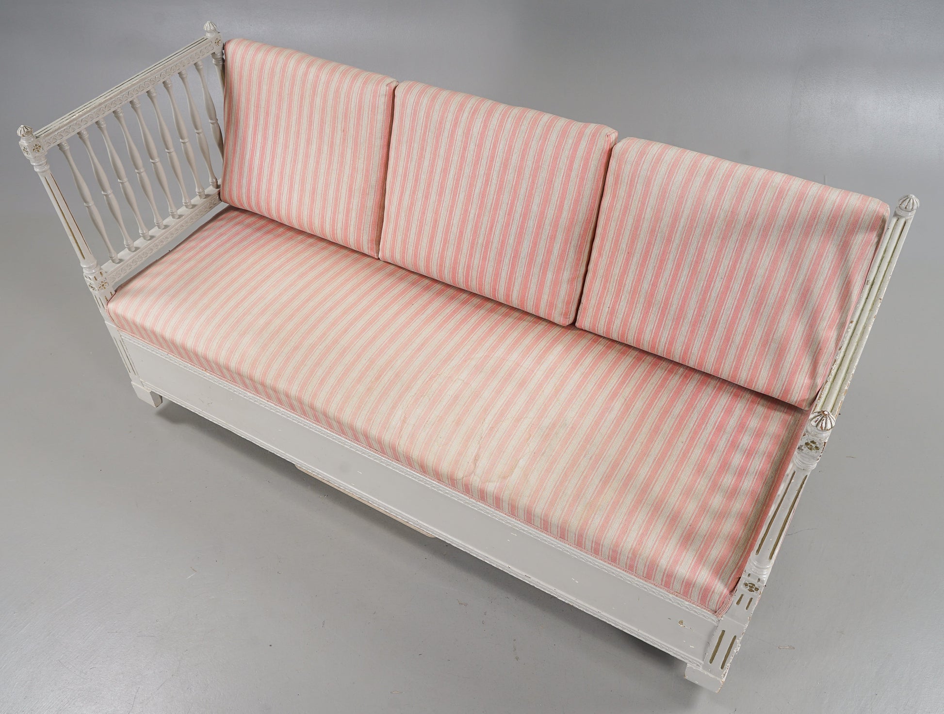 Gustavian-style daybed bench with loose pink striped back cushions
