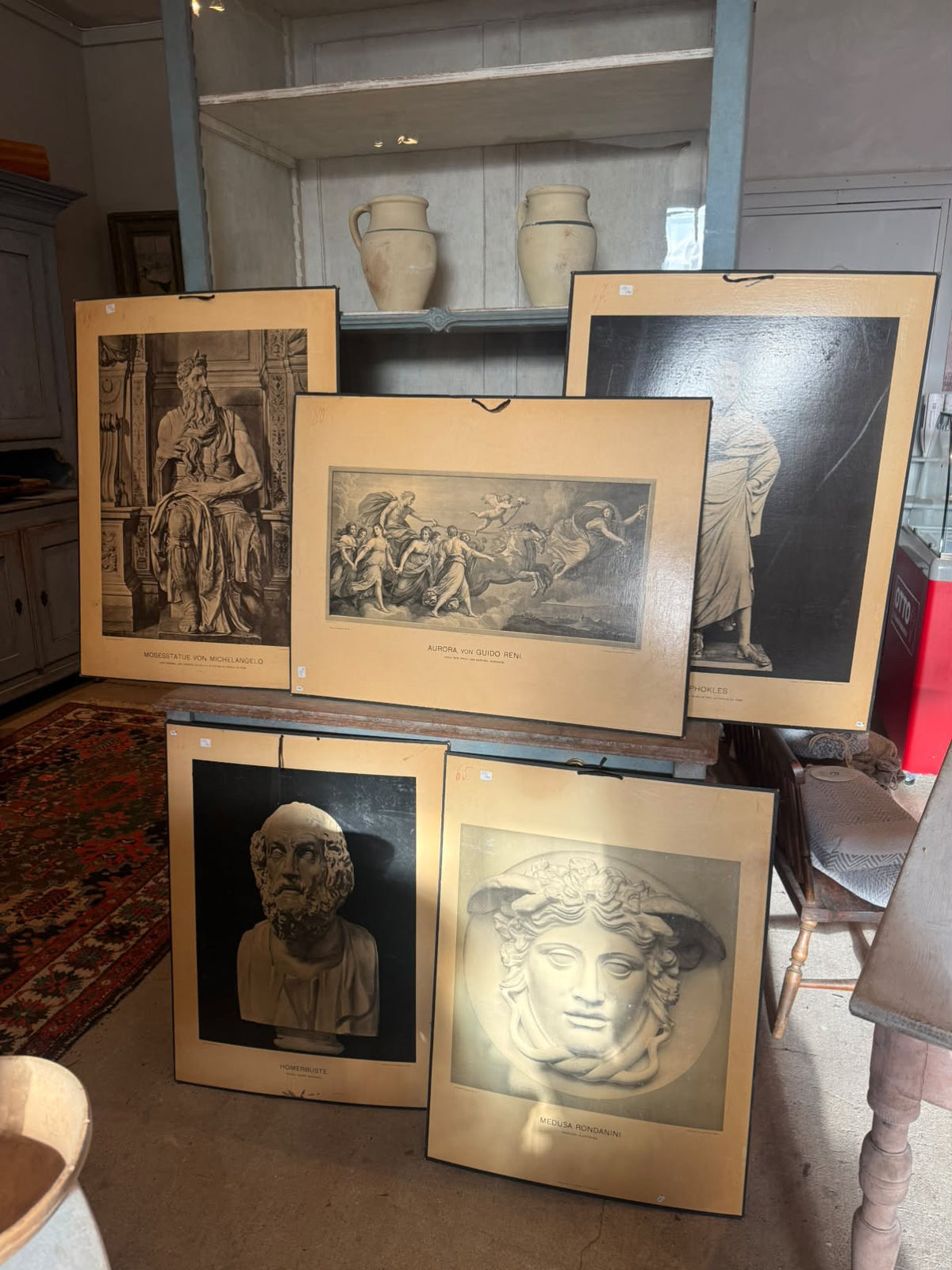 Set of five German art history plates displayed together in the showroom