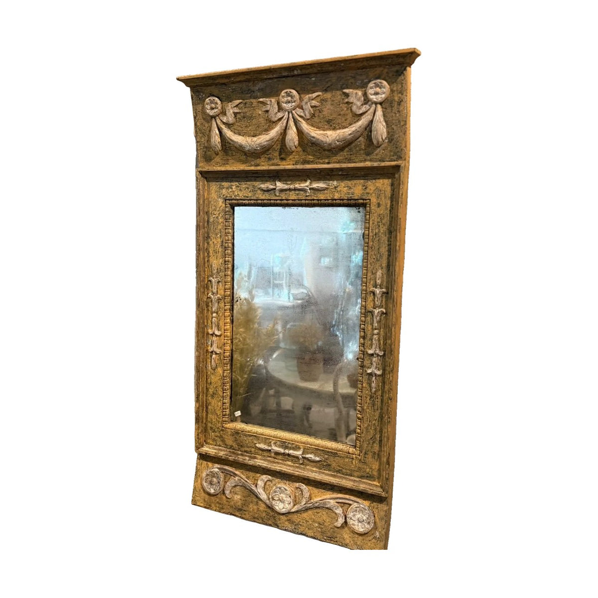 Swedish ochre painted mirror with carved swags, rosettes, and scrolling vine