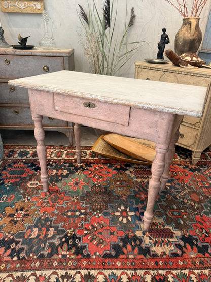 Swedish painted side table shown in the showroom on an antique rug