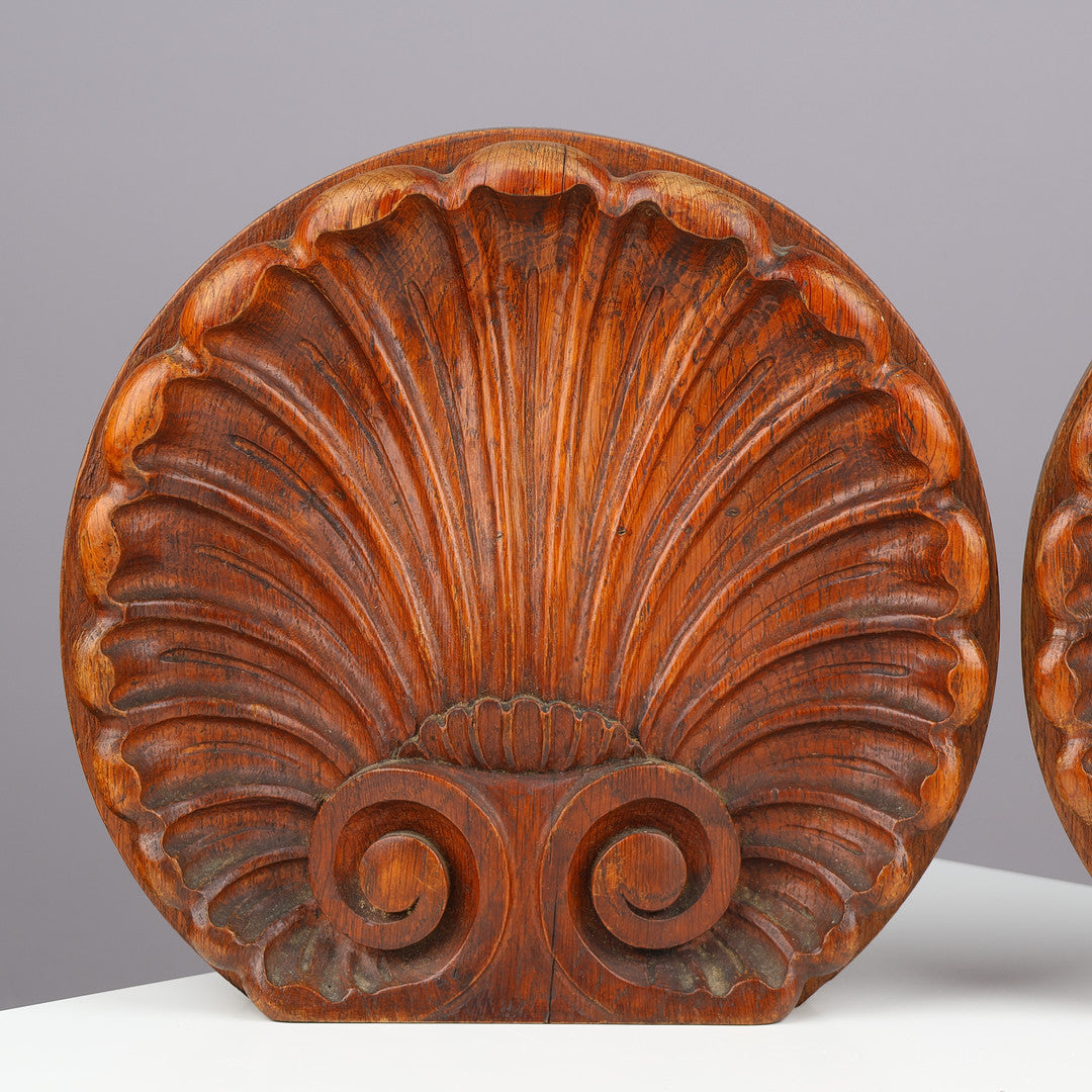 Pair of Danish carved oak scallop shell architectural ornaments
