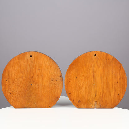 Back view of pair of Danish carved oak shell ornaments