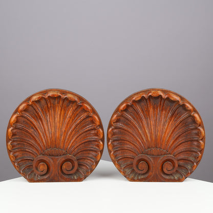 Pair of Danish carved oak scallop shell ornaments front view