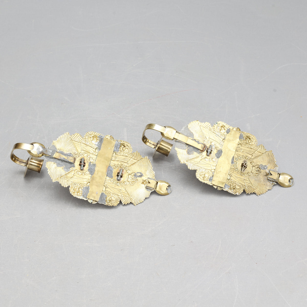 Pair of Candle Sconces Made from Military Cap Badges, 20th Century