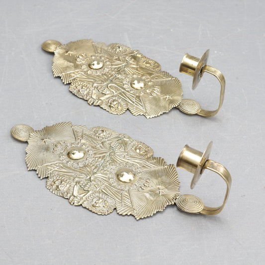 Pair of candle sconces made from military cap badges