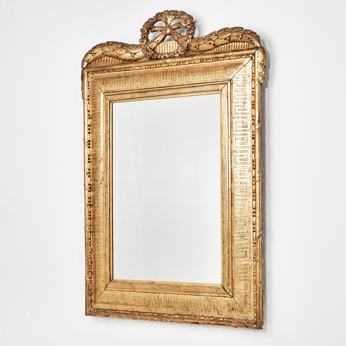 18th century carved and bronzed mirror with laurel festoons