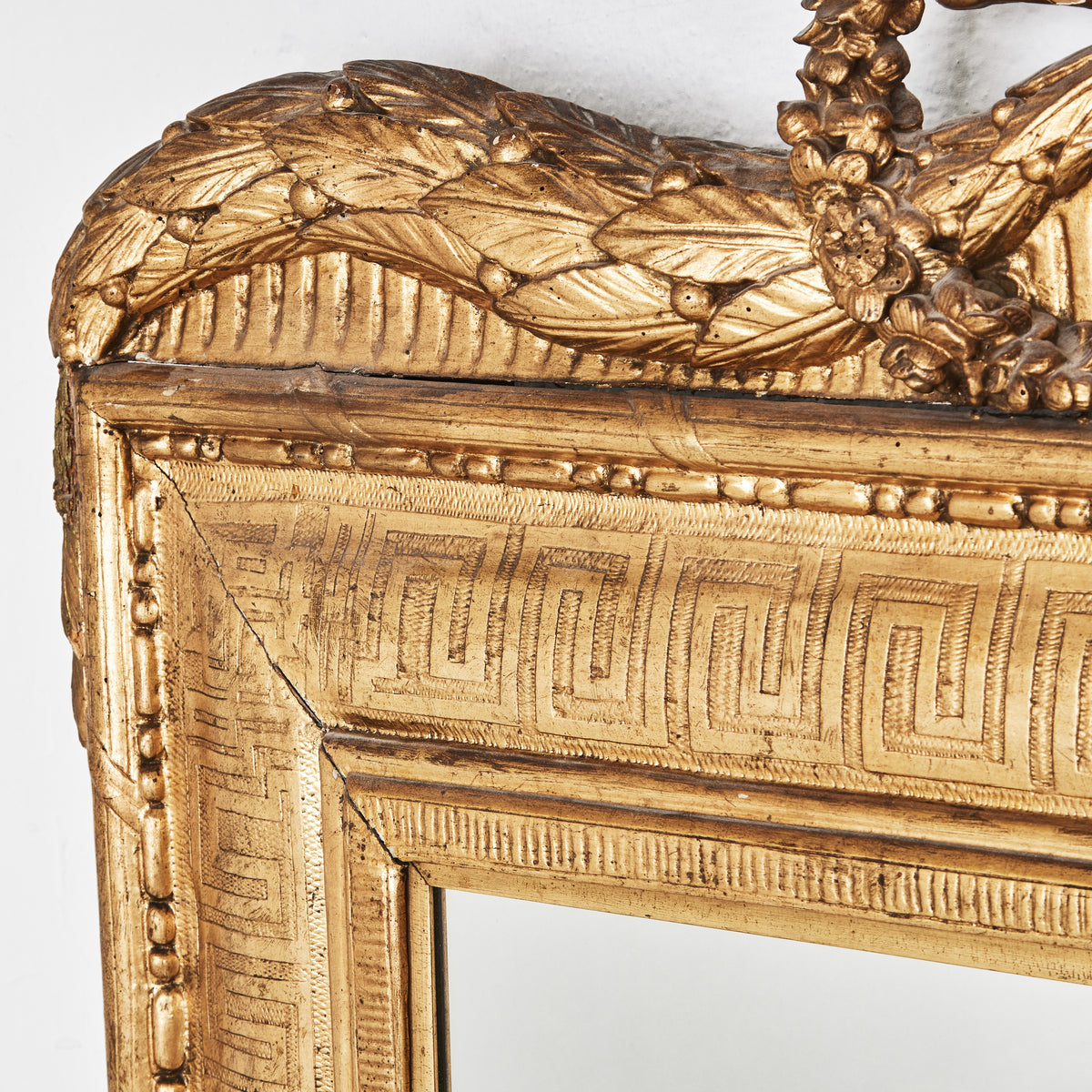 Northern European Carved and Bronzed Mirror with Laurel Festoons, 18th Century
