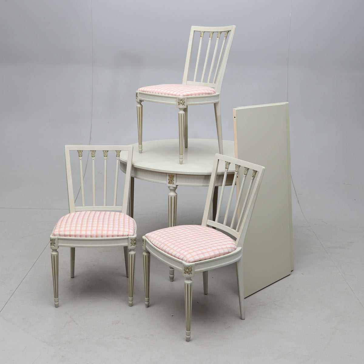 Gustavian style painted round dining table with three chairs