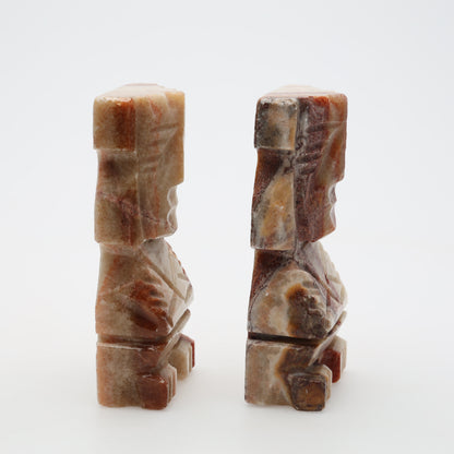 Profile view of carved stone bookends