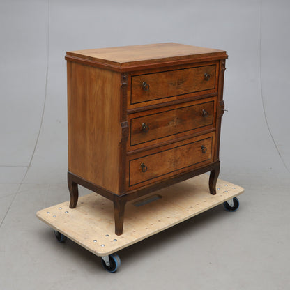 Walnut veneered three-drawer chest with ebonized details