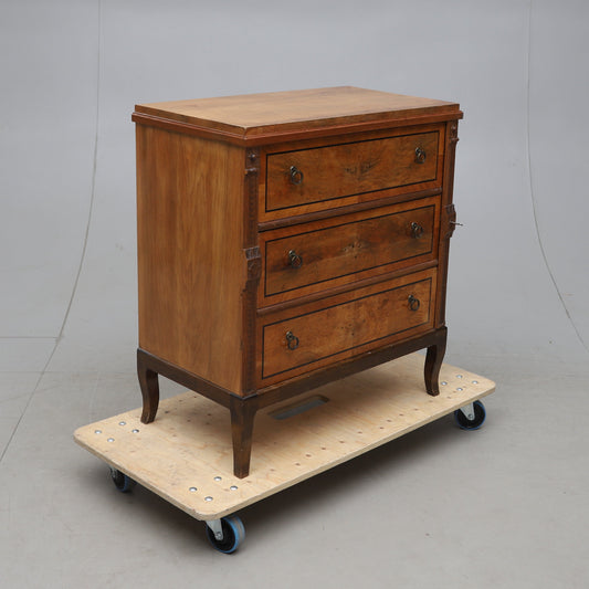 Walnut veneered three-drawer chest with ebonized details